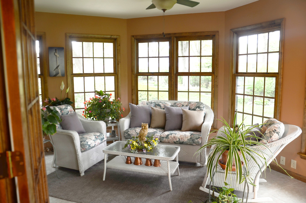 Inspiration for a large timeless gray floor sunroom remodel in Other with no fireplace and a standard ceiling