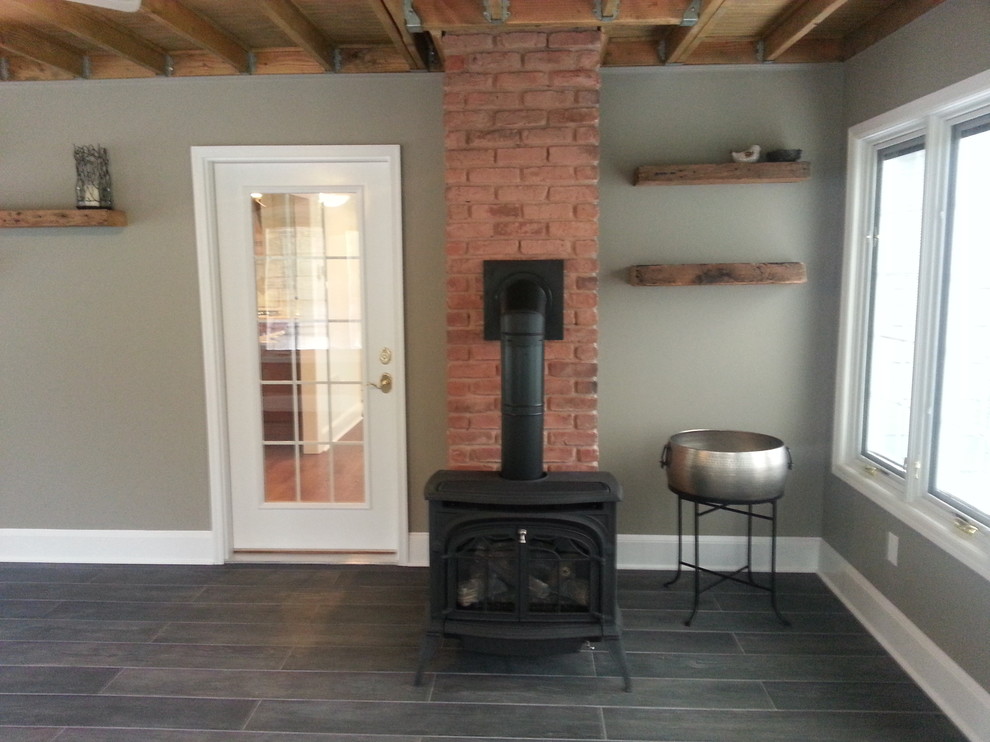 Sunroom: Gas Stove and Reclaimed Wood Shelves - Traditional - Sunroom