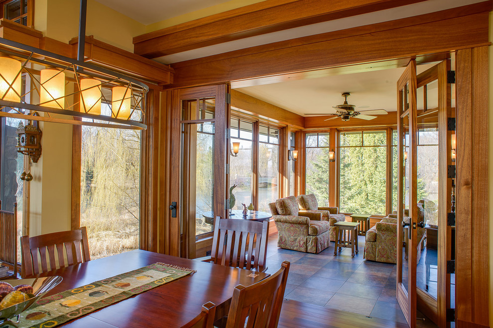 Inspiration for a craftsman brown floor sunroom remodel in Minneapolis