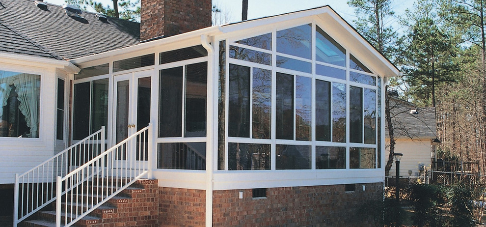 Medium sized traditional conservatory in Other with a skylight.