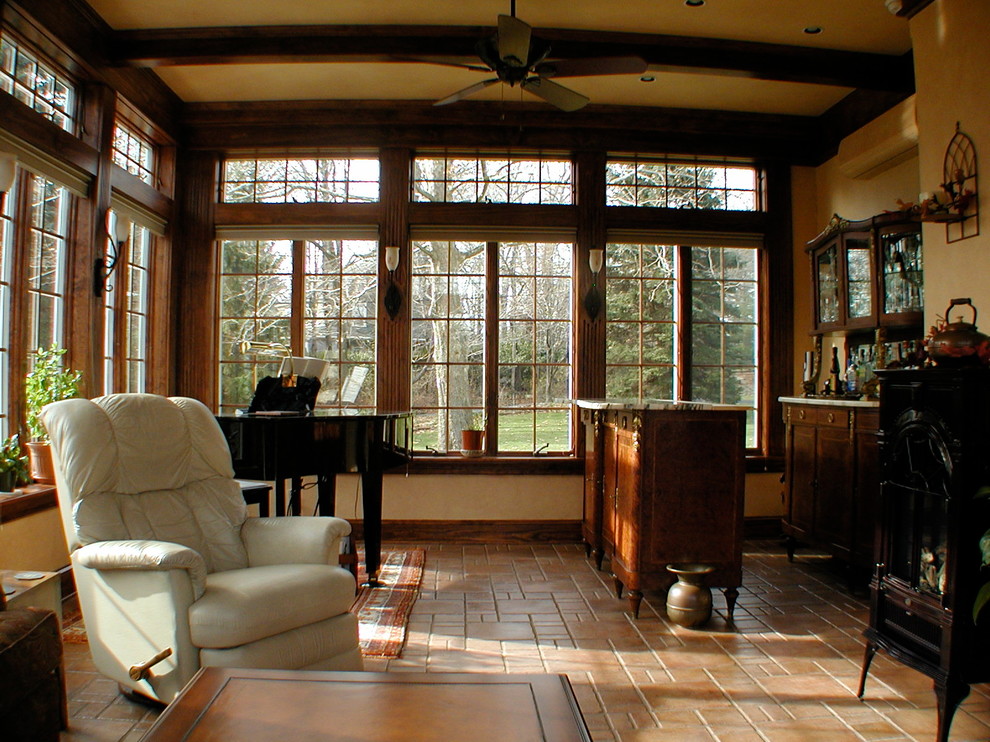Example of a mid-sized tuscan ceramic tile sunroom design in Philadelphia with a wood stove and a standard ceiling