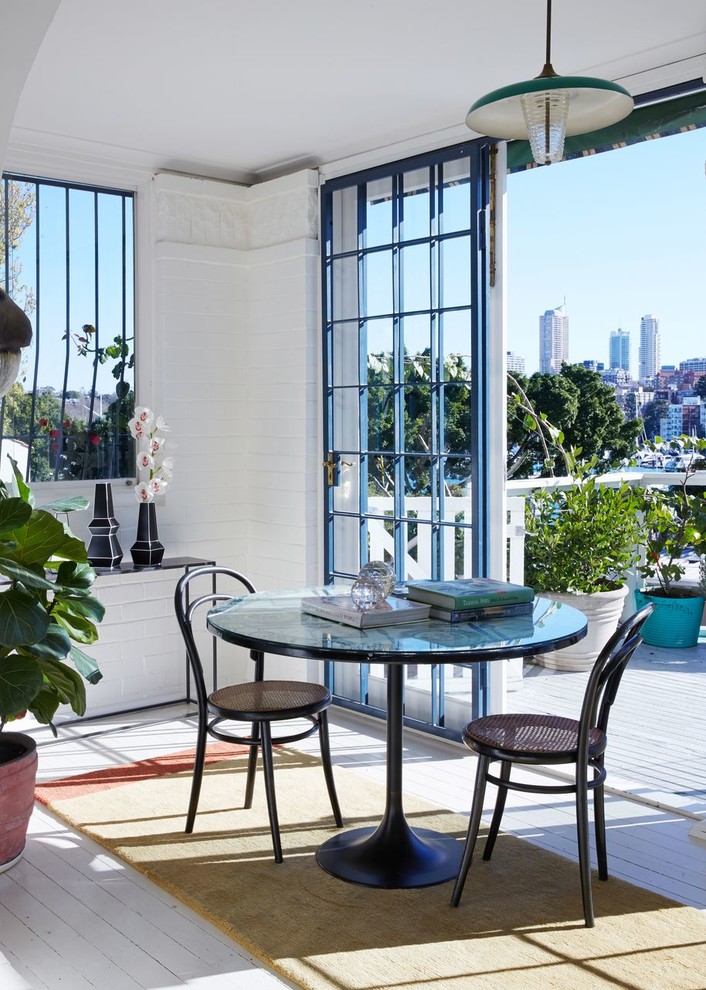 Example of a small painted wood floor and white floor sunroom design in Sydney