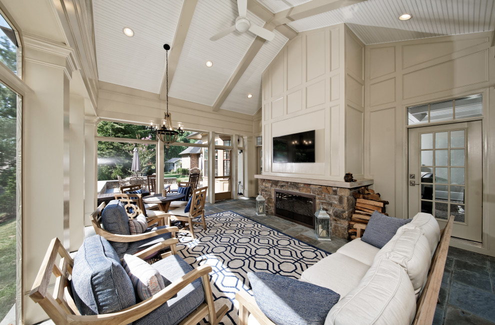 Huge transitional multicolored floor and slate floor sunroom photo in DC Metro with a two-sided fireplace, a brick fireplace and a standard ceiling