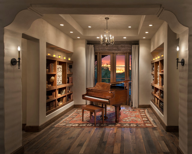 The Music Room/Library is seen through corbeled arched opening, with
