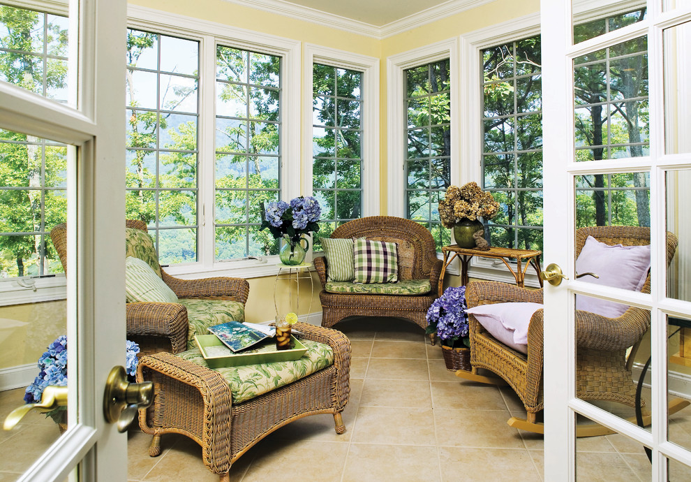 This is an example of a medium sized traditional conservatory in Charlotte.