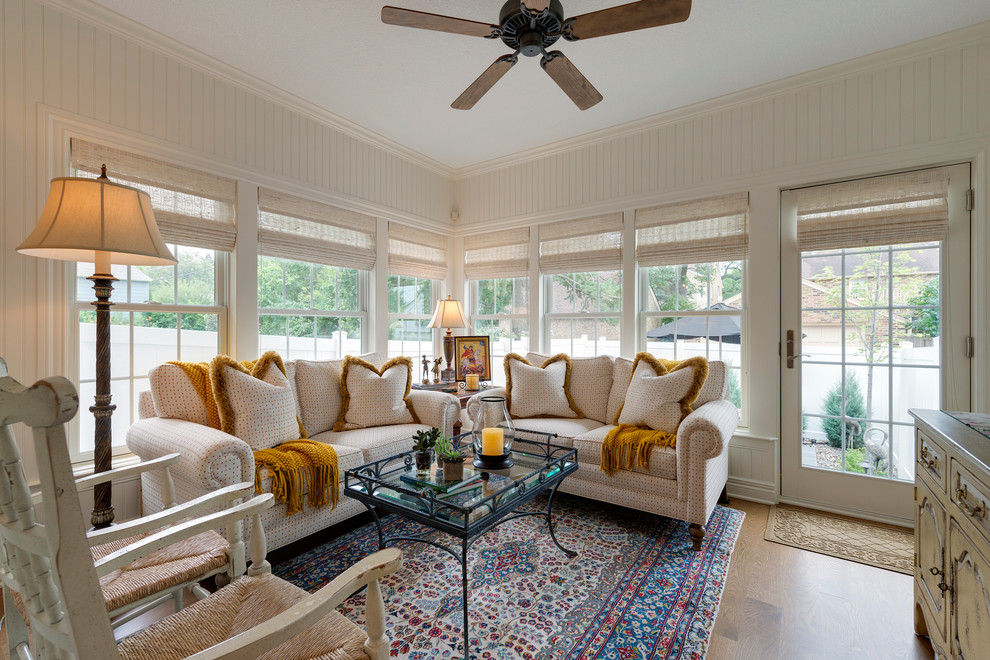 This is an example of a medium sized traditional conservatory in Minneapolis with a standard ceiling.