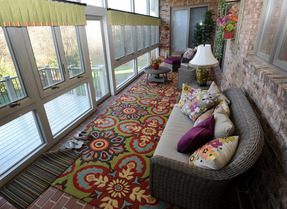 Example of a small tuscan brick floor sunroom design in Detroit with a standard ceiling