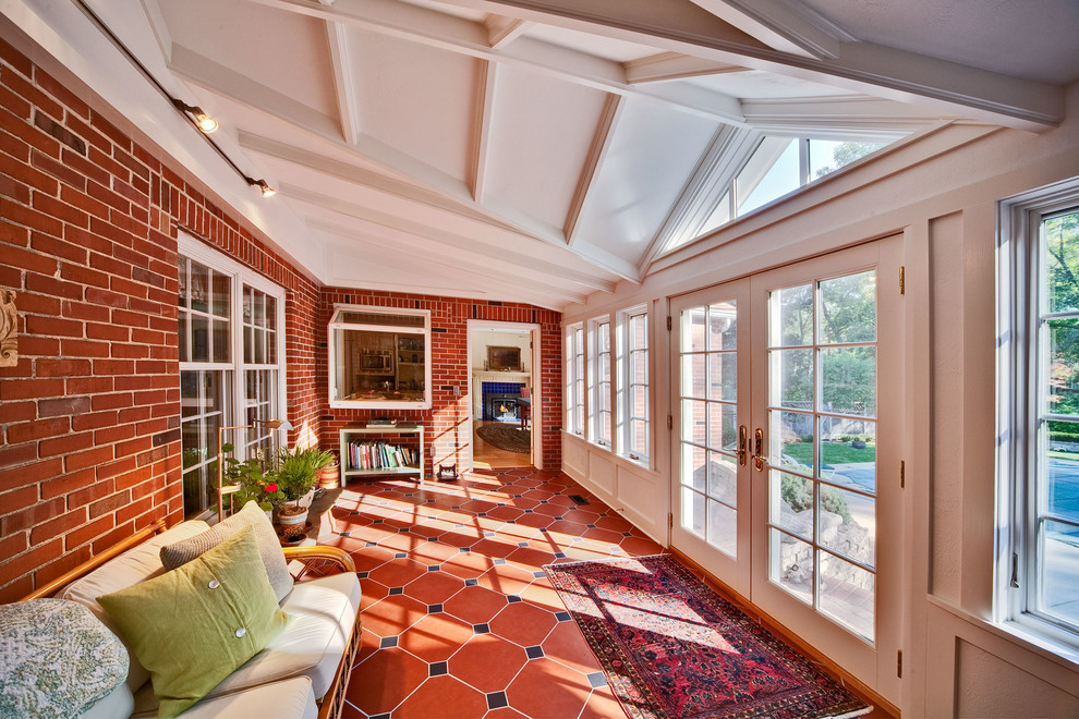 Example of a classic red floor sunroom design in Other with a standard ceiling