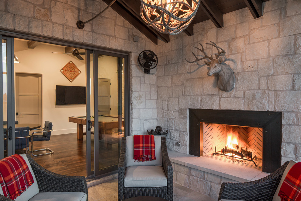Sunroom - mid-sized farmhouse sunroom idea in Austin with a standard fireplace