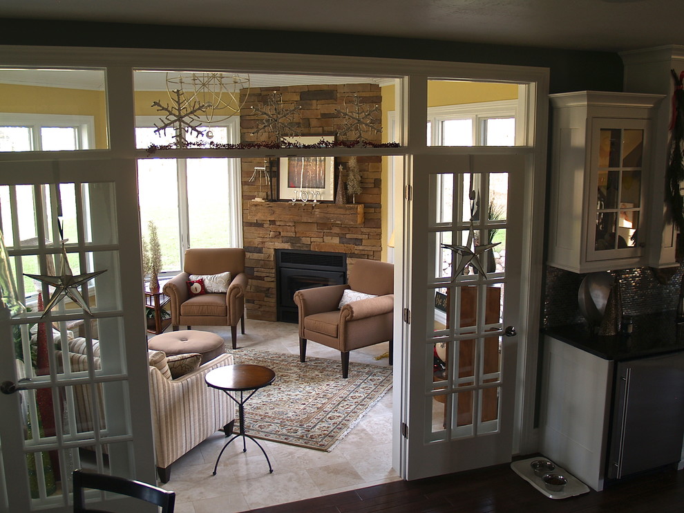 Example of a transitional travertine floor sunroom design in Milwaukee with a corner fireplace and a stone fireplace