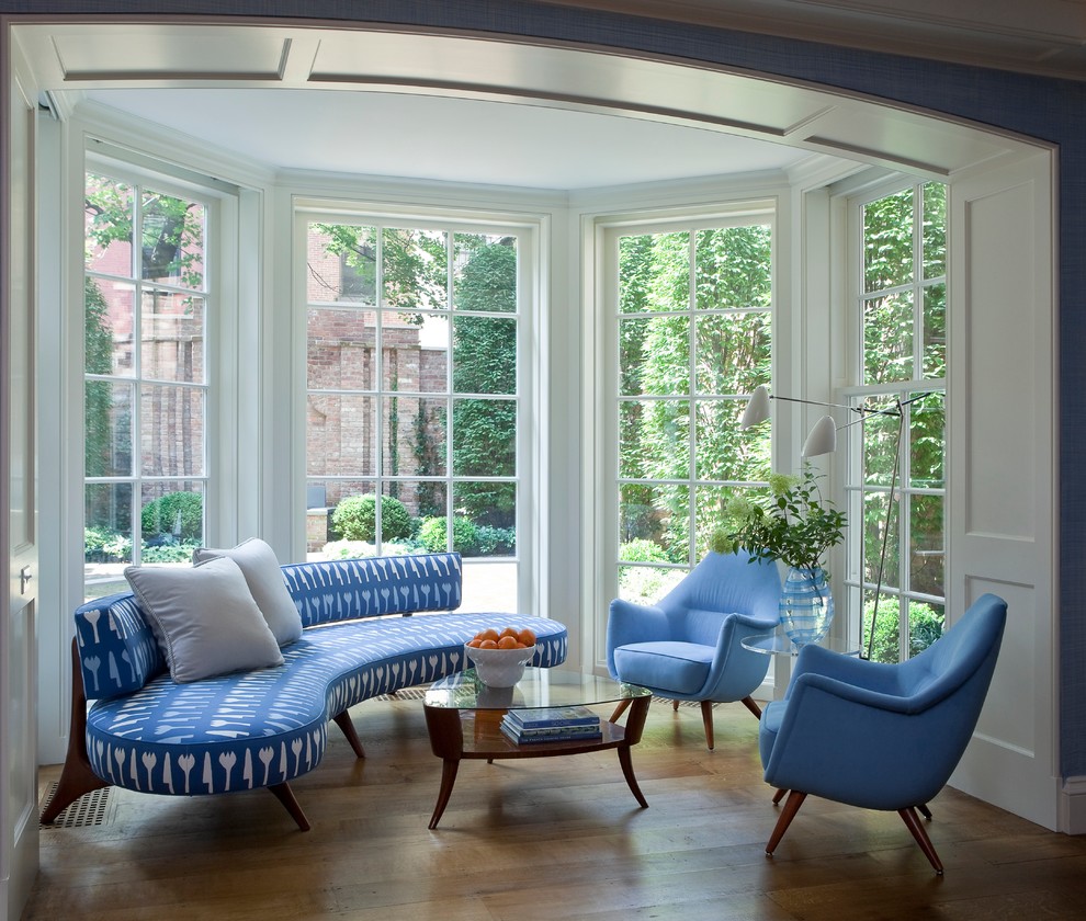 Photo of a classic conservatory in New York with medium hardwood flooring.