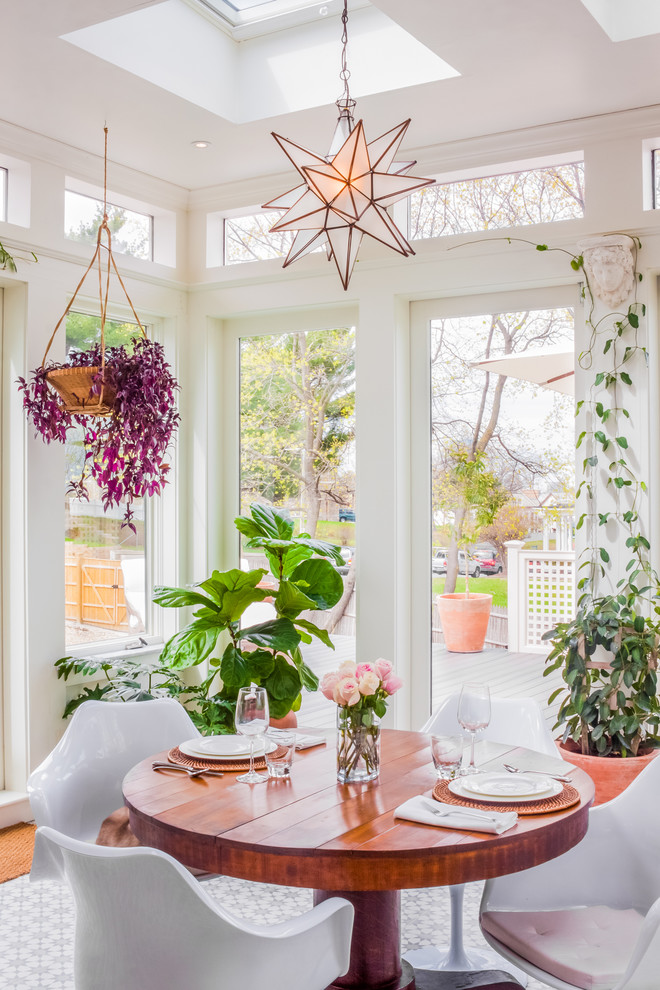 Transitional sunroom photo in Boston with a skylight