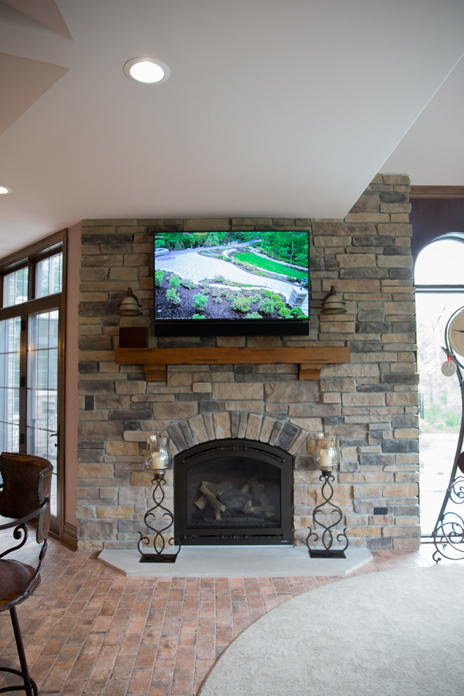 Design ideas for a classic conservatory in Chicago with a standard fireplace and a brick fireplace surround.