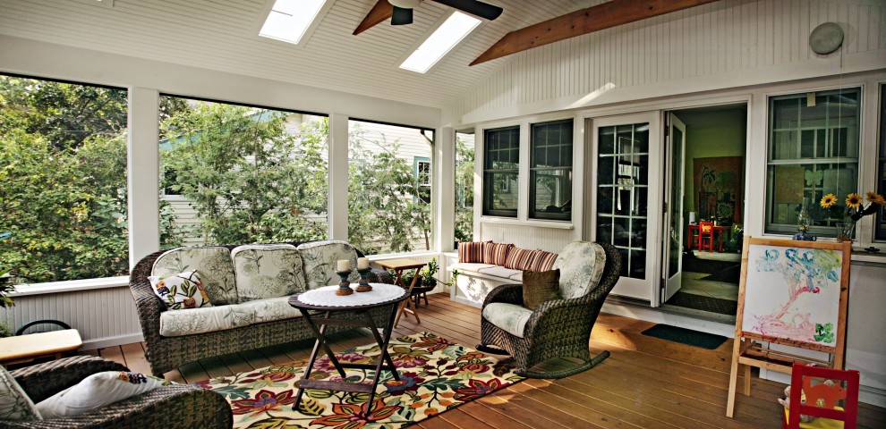 Inspiration for a large timeless medium tone wood floor sunroom remodel in DC Metro with no fireplace and a skylight