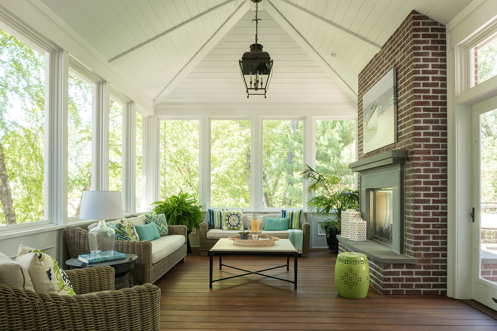 Inspiration for a timeless sunroom remodel in Minneapolis with a standard fireplace, a brick fireplace and a standard ceiling