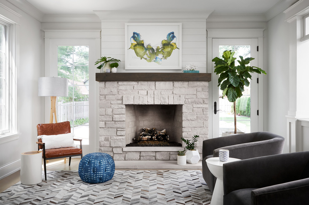 Inspiration for a transitional sunroom remodel in Chicago with a standard fireplace, a stone fireplace and a standard ceiling