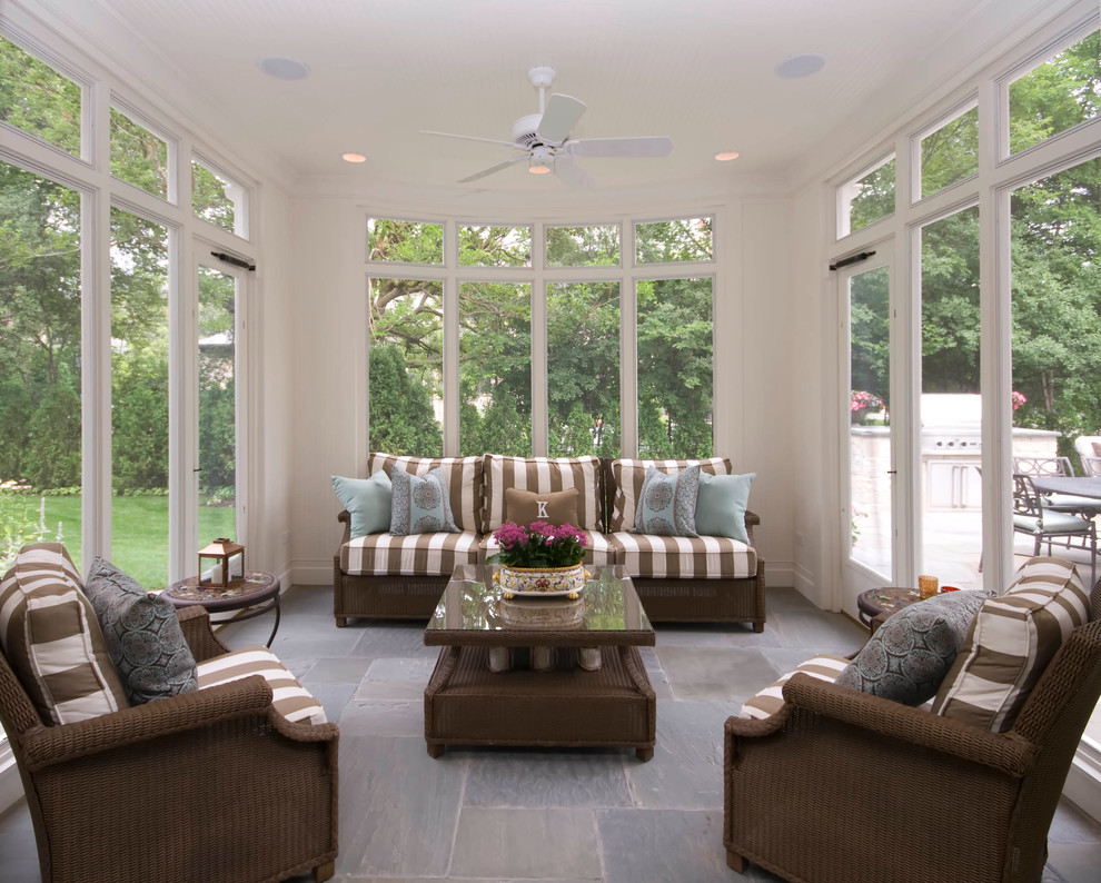 Inspiration for a large classic conservatory in Chicago with slate flooring, no fireplace, a standard ceiling and brown floors.