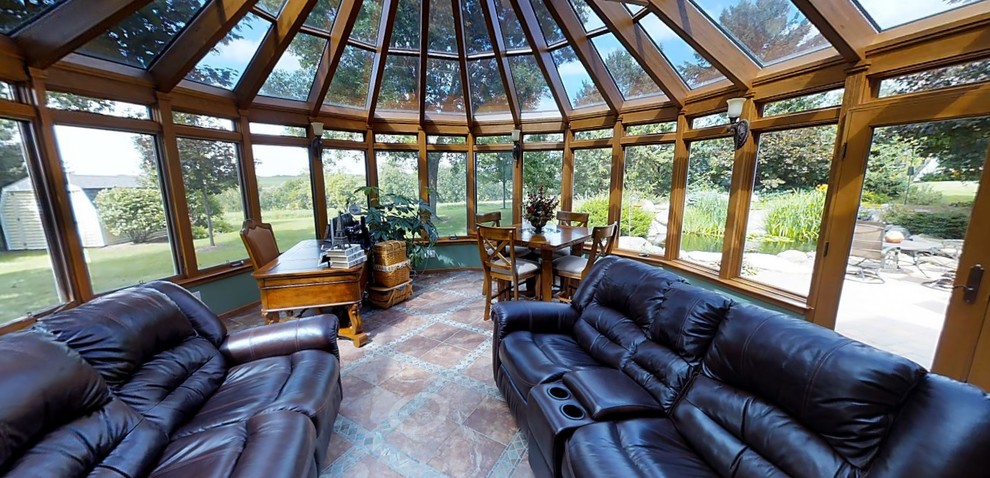 Inspiration for a medium sized contemporary conservatory in Other with a glass ceiling, terracotta flooring, a standard fireplace and a stone fireplace surround.