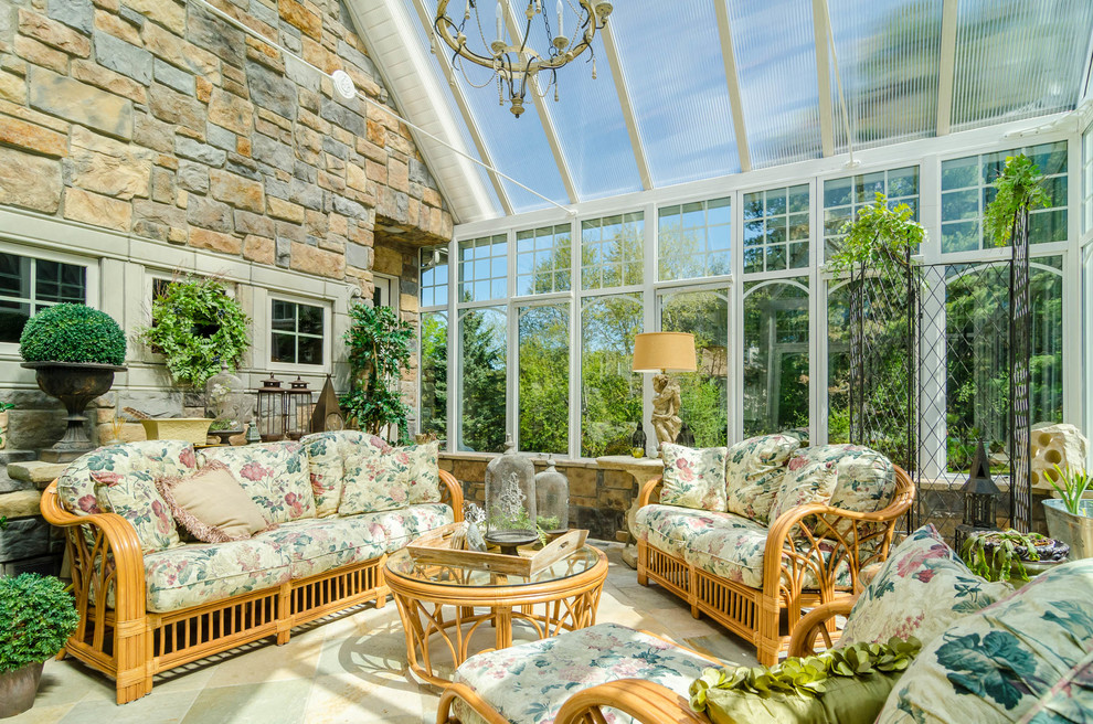 Photo of a medium sized classic conservatory in Minneapolis with a glass ceiling and travertine flooring.