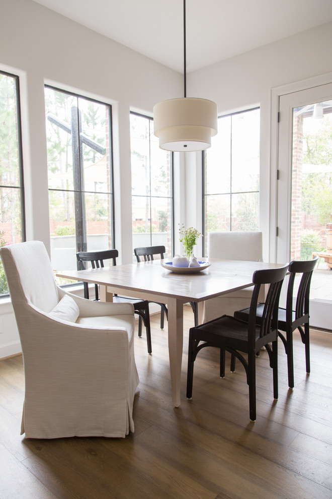 Dining room - transitional medium tone wood floor dining room idea in Houston