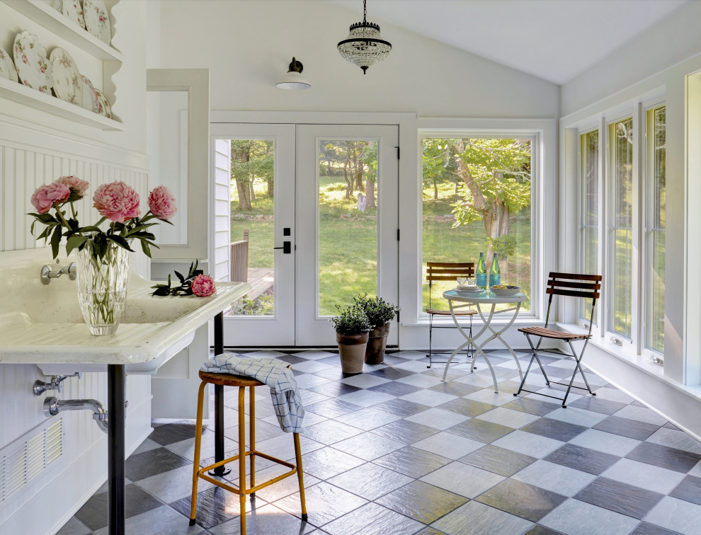 Example of a farmhouse sunroom design in Other
