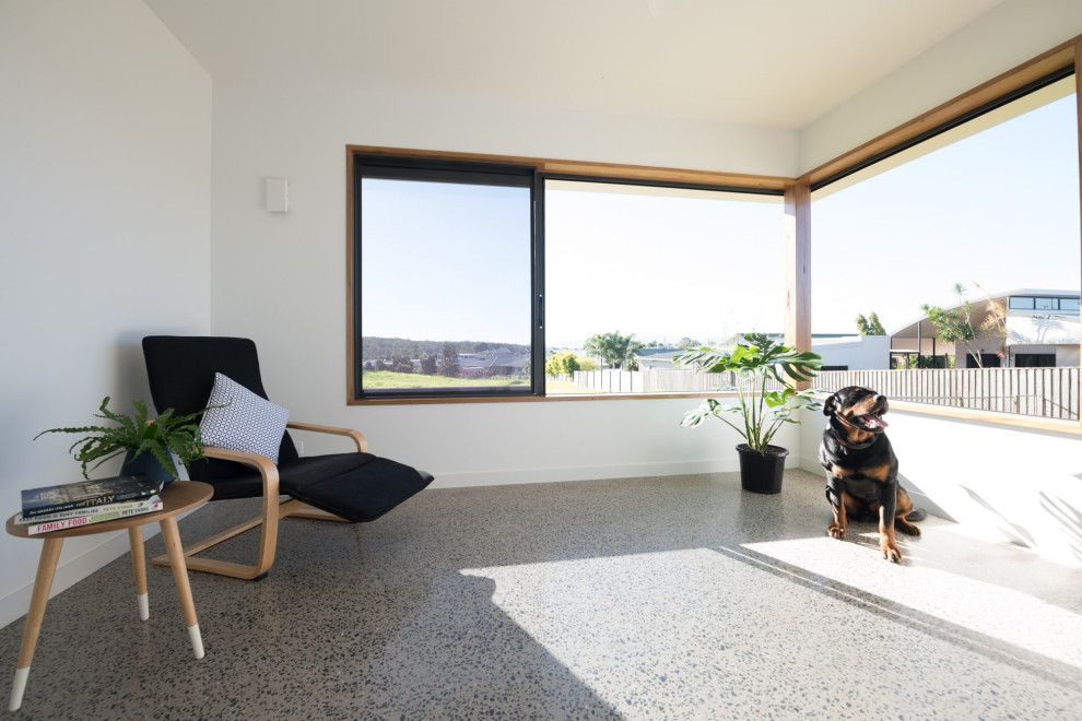Inspiration för små moderna uterum, med betonggolv och grått golv