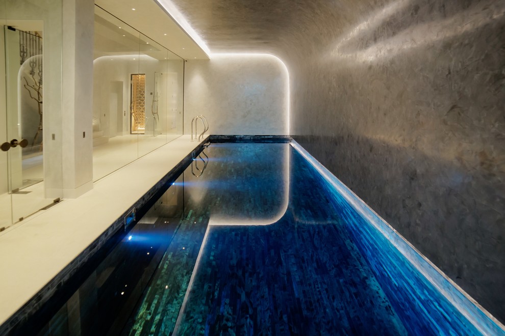 Small trendy indoor rectangular lap pool photo in London