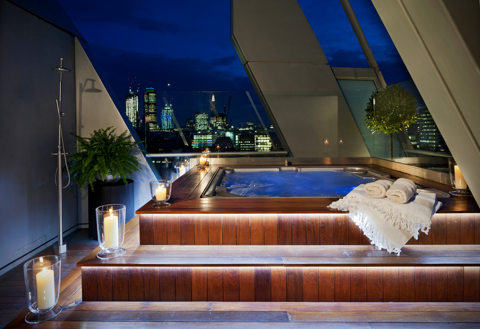 Design ideas for a contemporary roof swimming pool in London with a shelter.