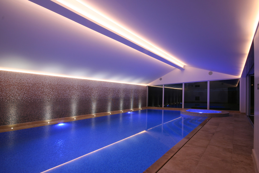Photo of a contemporary indoor swimming pool in London.