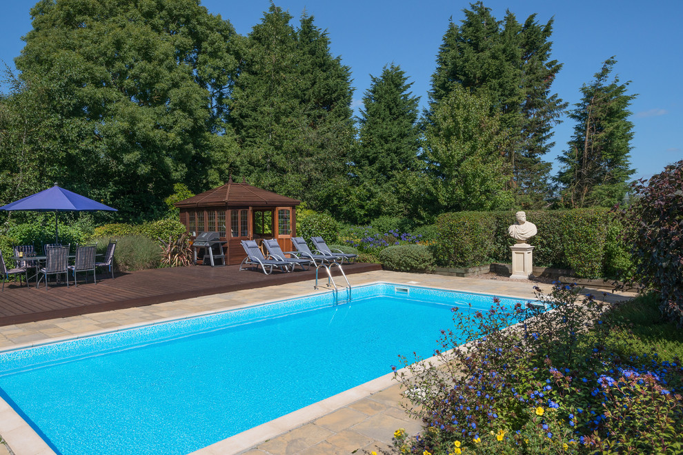 Design ideas for a country rectangular swimming pool in Devon with a bbq area.