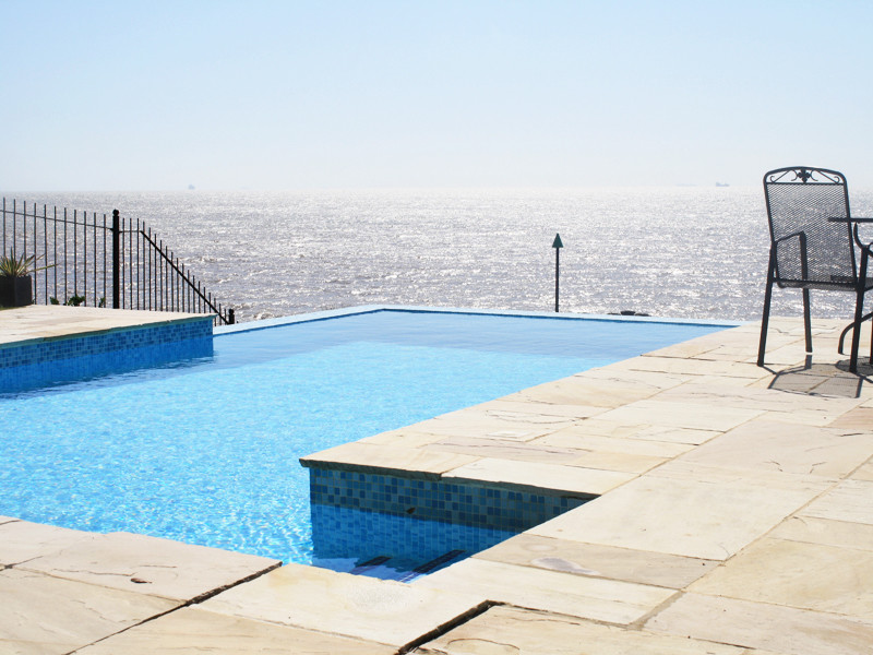 Inspiration for a medium sized contemporary rectangular infinity swimming pool in London.
