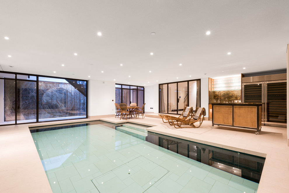 Design ideas for a medium sized contemporary indoor rectangular lengths swimming pool in London.