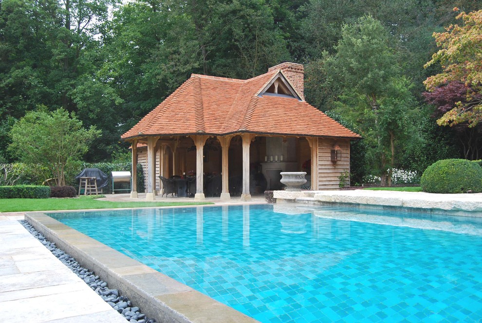 Design ideas for a traditional swimming pool in Hampshire with a pool house.