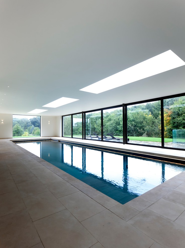 Transitional indoor rectangular pool photo in Gloucestershire