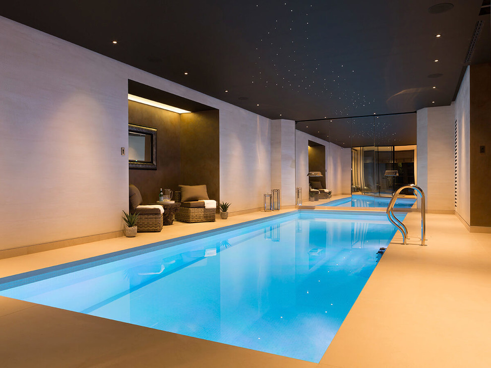 Medium sized contemporary indoor rectangular lengths swimming pool in London.