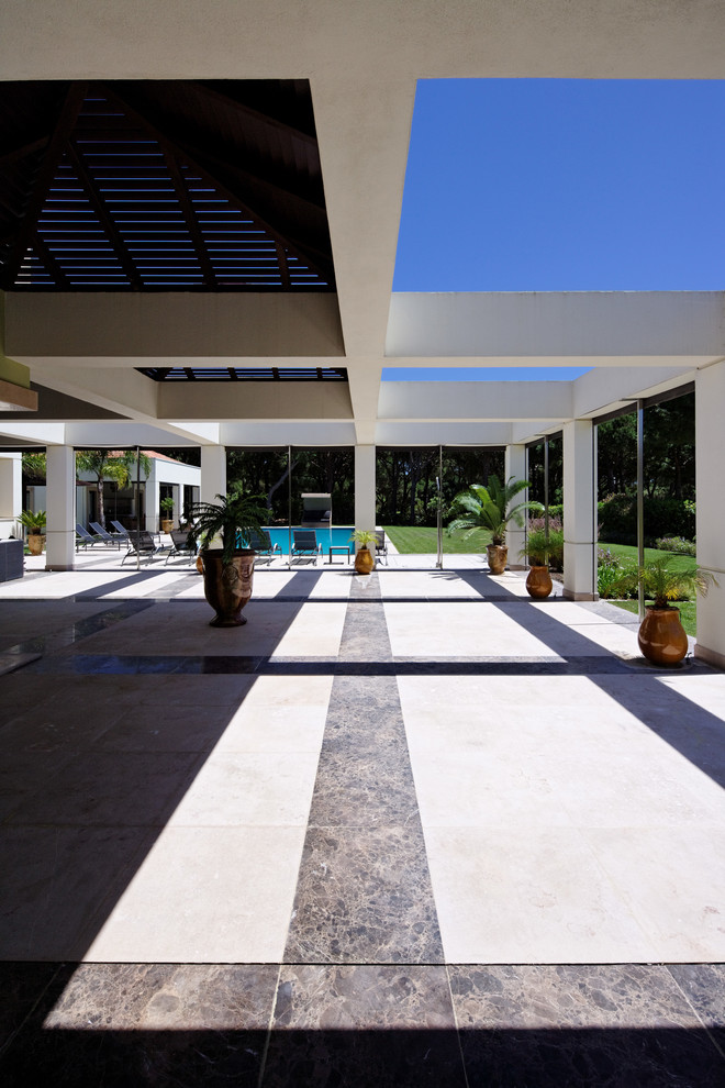 Photo of an expansive contemporary side swimming pool in Other.