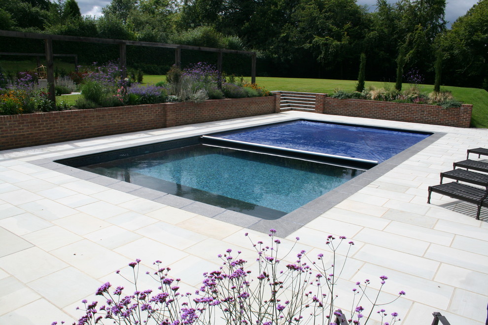 Elegant pool photo in Surrey