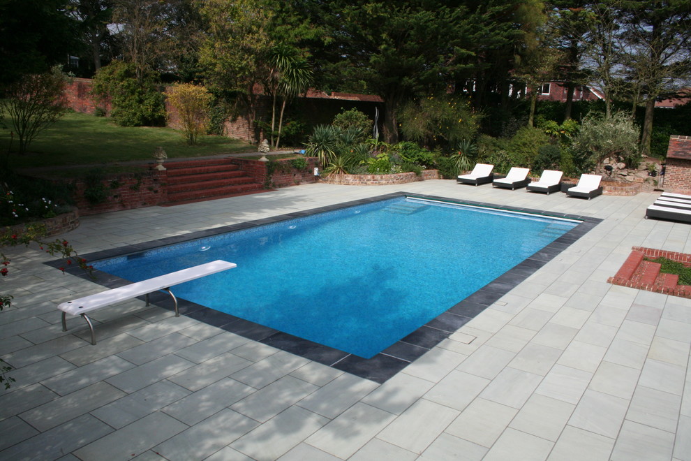 Design ideas for a traditional swimming pool in Surrey.