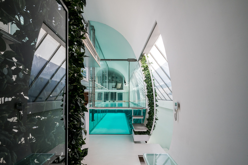 Medium sized contemporary rectangular swimming pool in London.