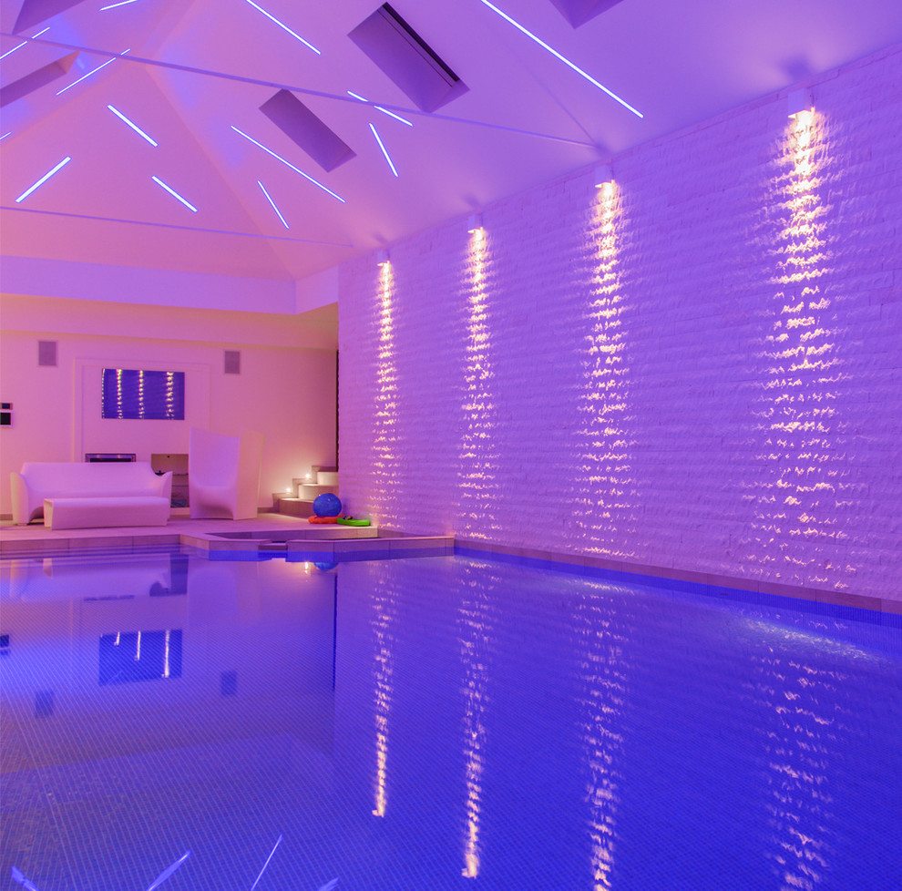Example of a trendy indoor rectangular pool design in Surrey