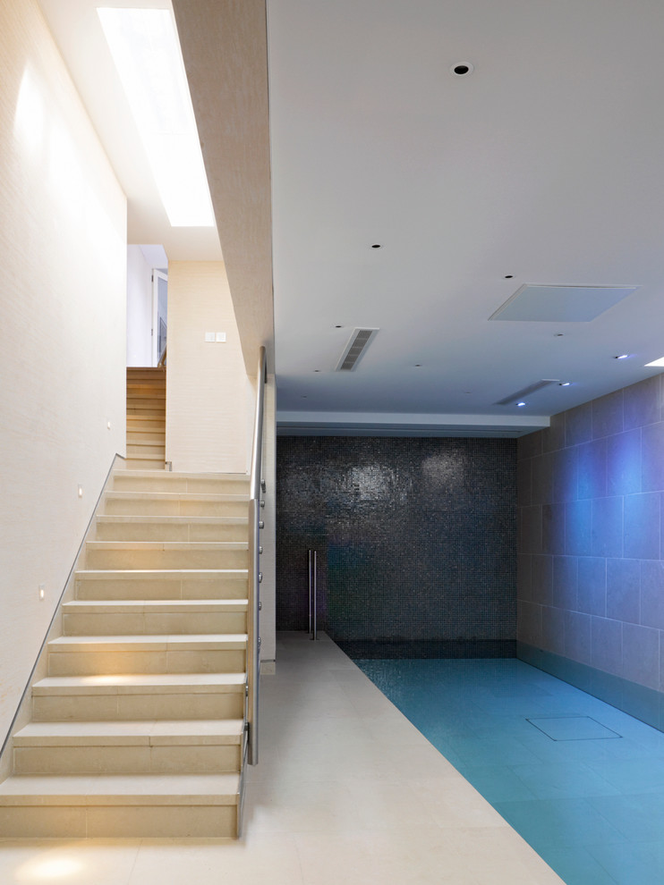 Inspiration for a contemporary indoor rectangular pool remodel in London