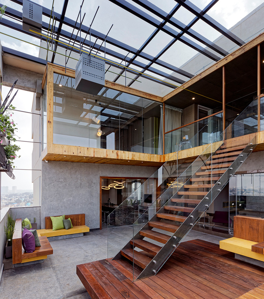 Photo of a large contemporary roof terrace in Bengaluru with a roof extension.