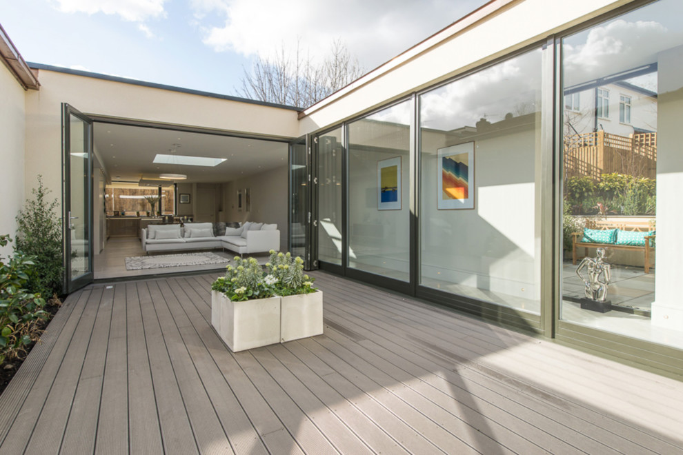 This is an example of a contemporary back terrace in London with no cover.