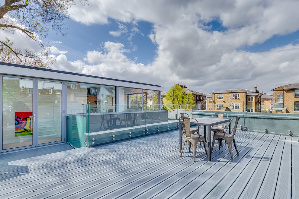 Example of a large trendy rooftop rooftop deck design in London with no cover