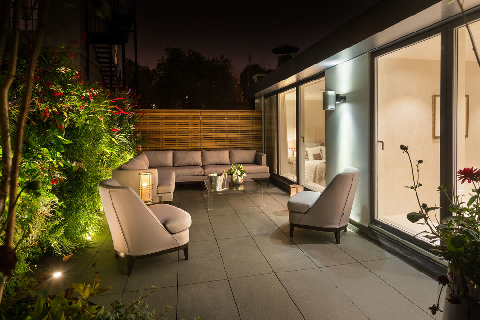Inspiration for a medium sized contemporary roof terrace in London with no cover.
