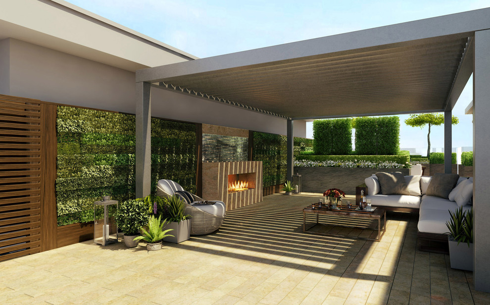 Cette image montre une terrasse design avec aucune couverture et un foyer extérieur.