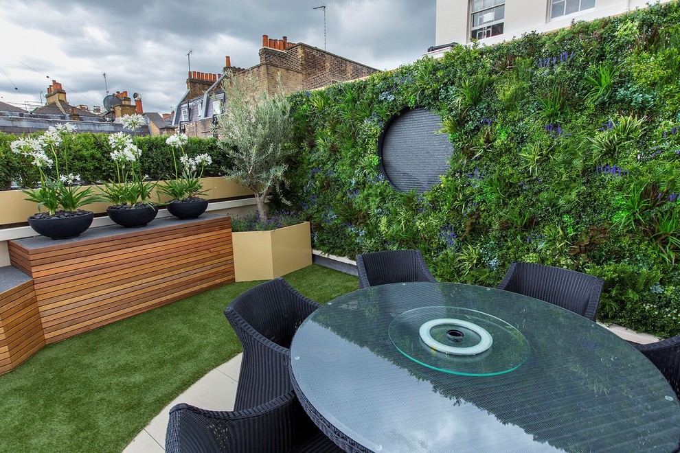 Design ideas for a medium sized contemporary roof terrace in Surrey with a living wall and no cover.