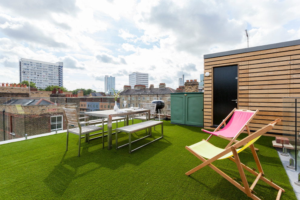 Example of a mid-sized trendy rooftop rooftop deck design in London with no cover