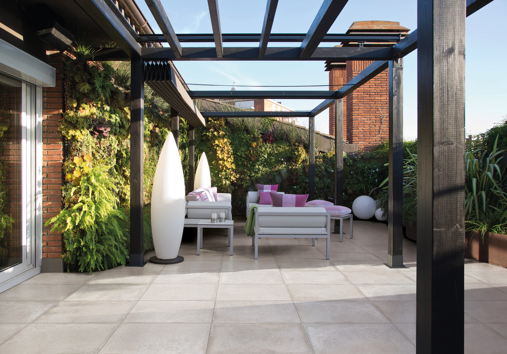 This is an example of a contemporary roof rooftop terrace in Belfast with a living wall and a pergola.
