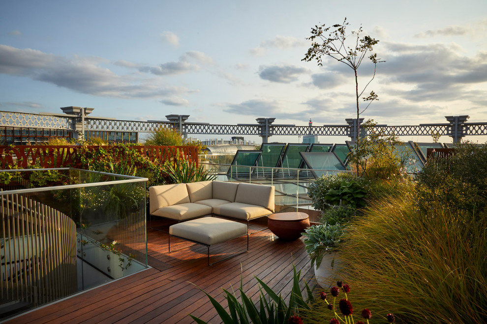 Design ideas for a contemporary rooftop glass railing terrace in London.